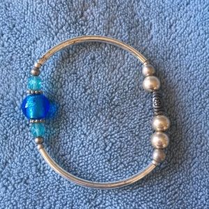 Silver toned and blue bead bracelet.